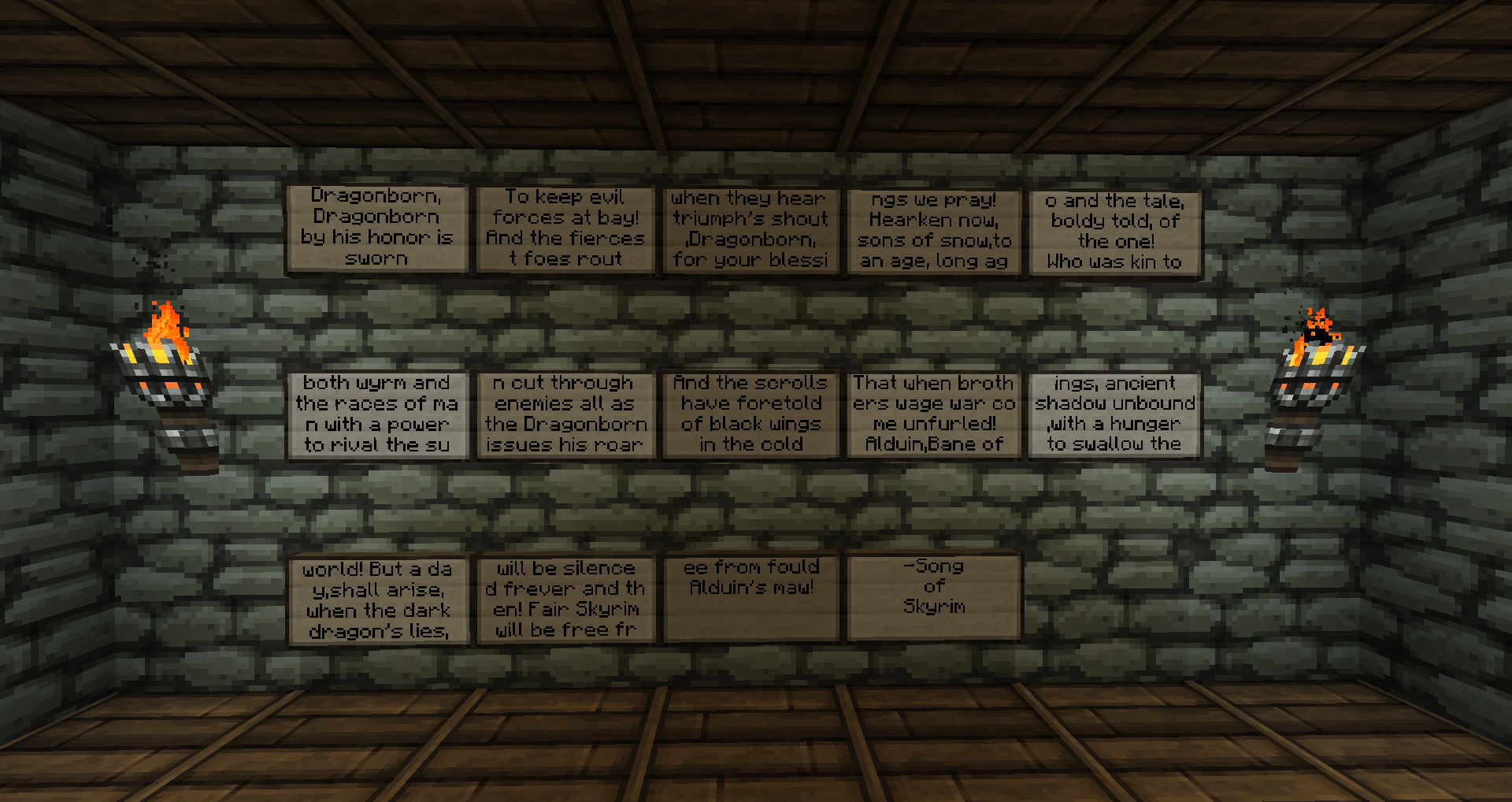 A wall of signs with text on them, in a stone room with torches.