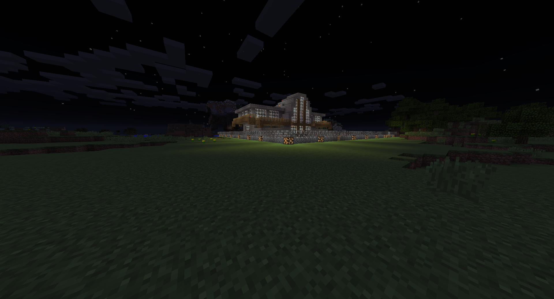 A large base in the middle of a field at night.