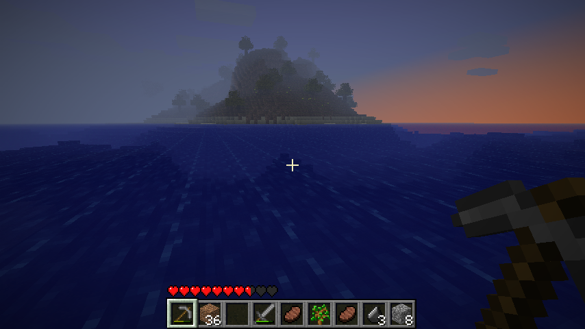 A player is standing in the ocean, looking at a small island with trees and a sunset in the background.