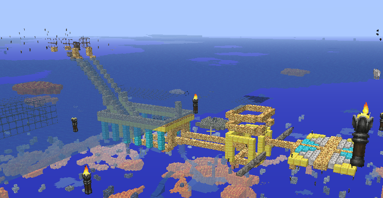 A large, intricate build in the ocean, featuring a mix of gold and blue blocks, with several torches and a long staircase leading up to it.