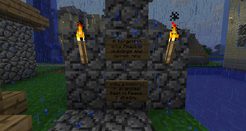 A memorial in anandite, featuring a sign with text and a torch on top.