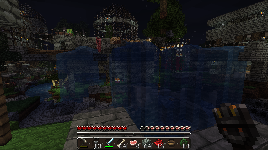 A player is standing in front of a large body of water, with a stone structure visible in the background.