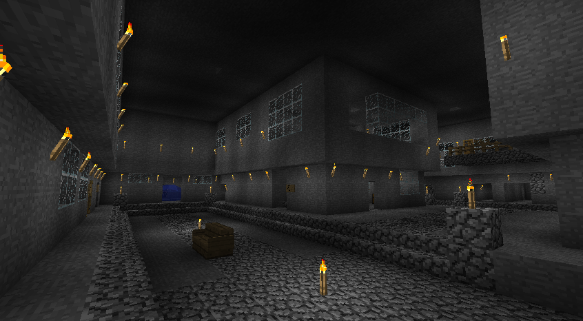 A large underground base with many rooms and a cobblestone floor, lit by glowstone.