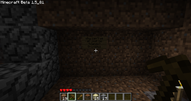 A dark cave with a player's inventory visible at the bottom of the screen.