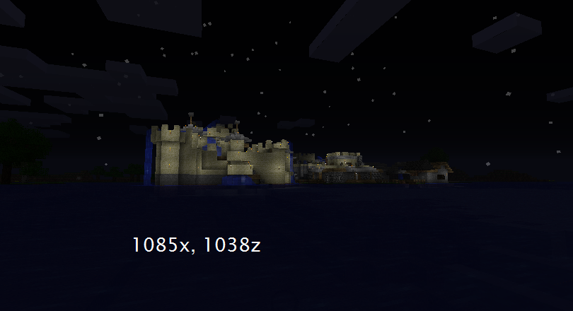 A large castle build with a moat, surrounded by water and a night sky.