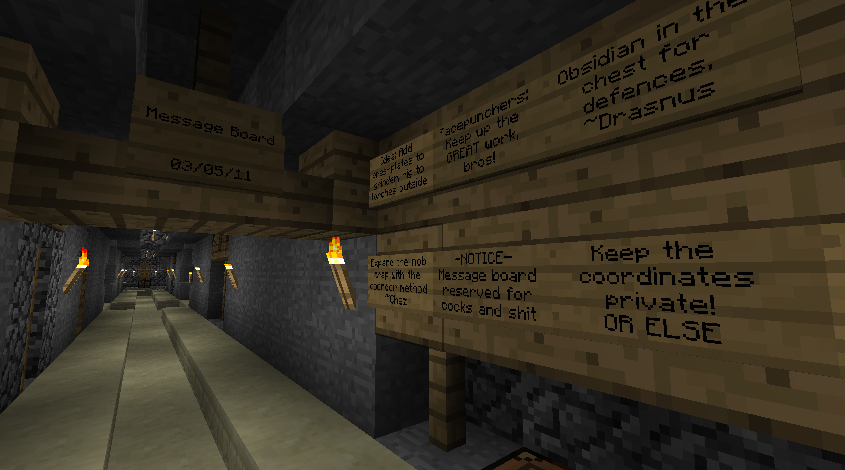 A long hallway with signs on the walls, containing text.