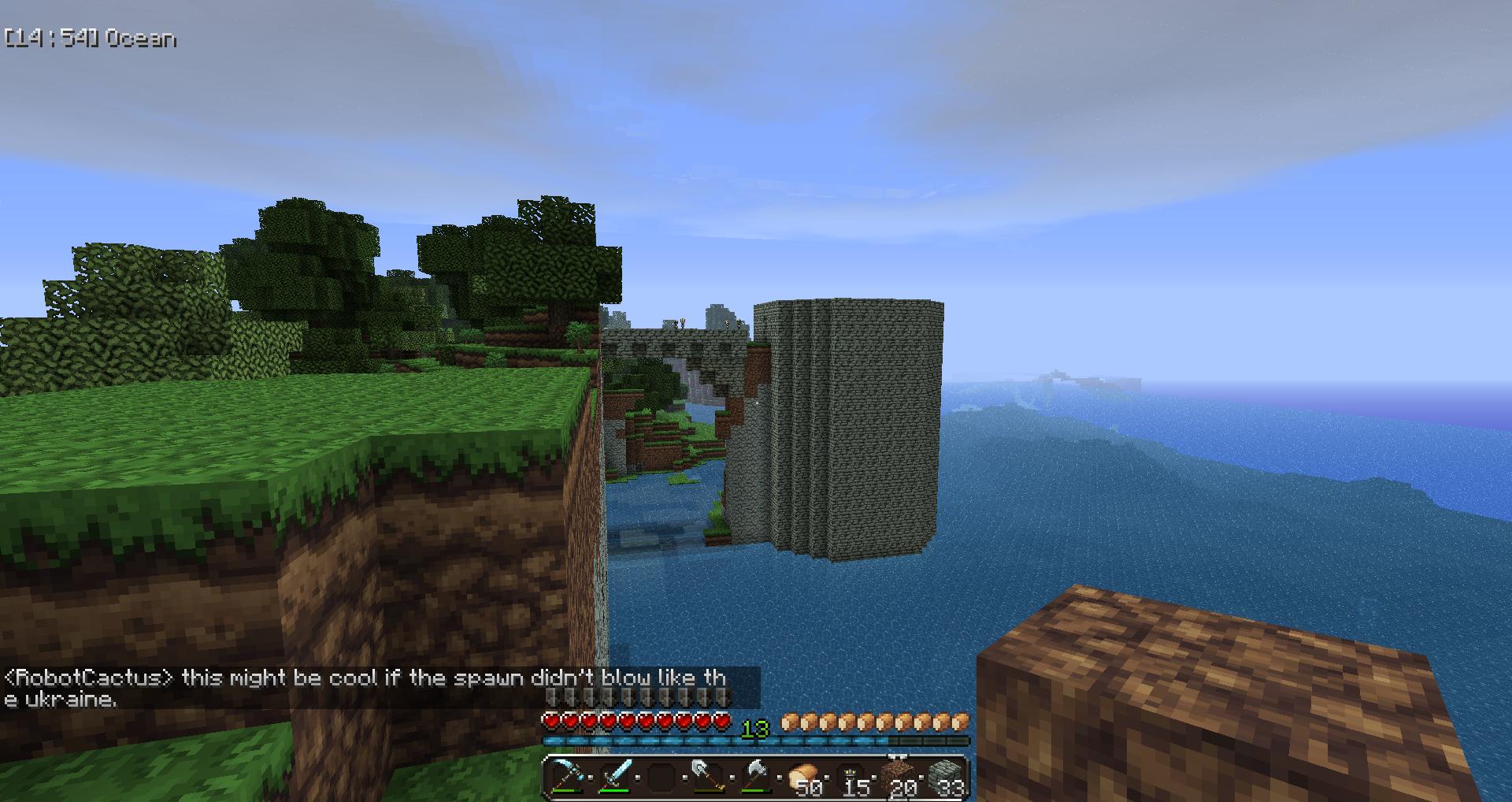 A player is standing on a cliff overlooking a body of water with two large structures in the distance.