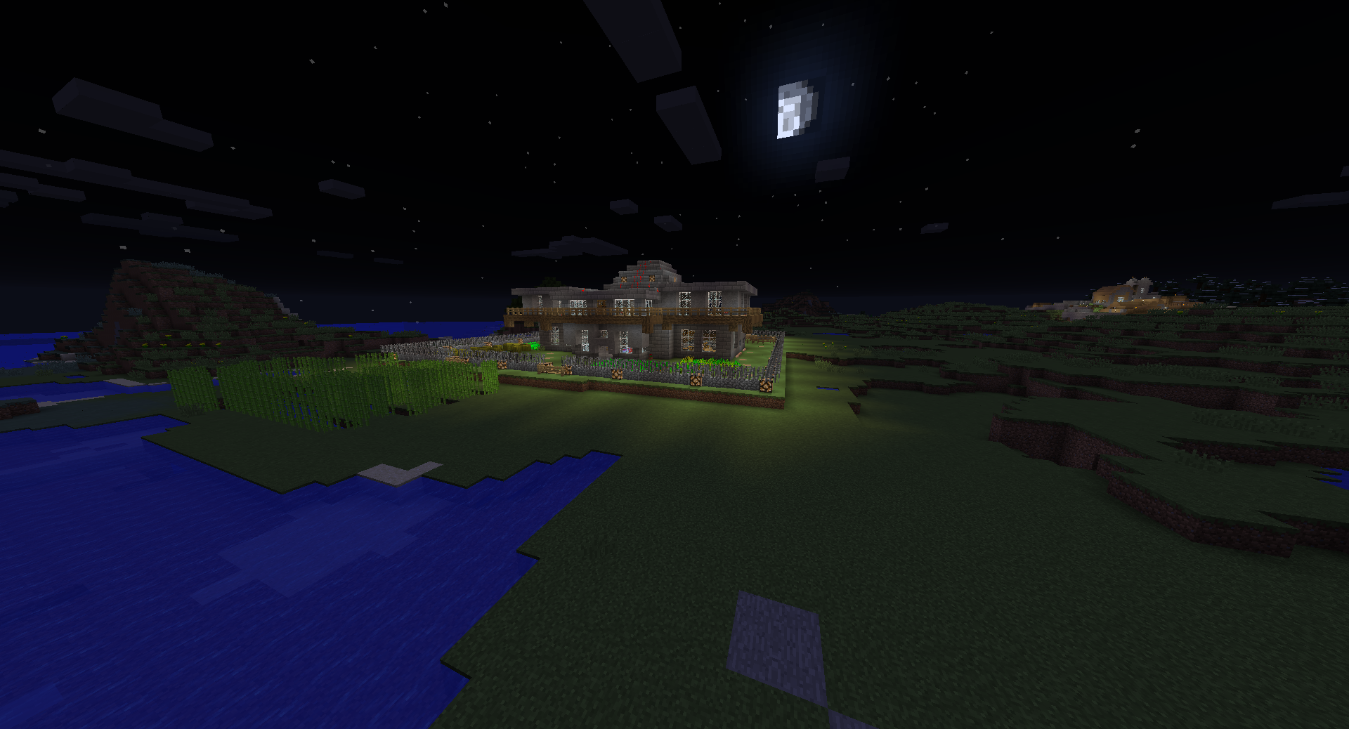 A large house on a grassy island in the middle of a body of water, with a dark sky and stars visible.