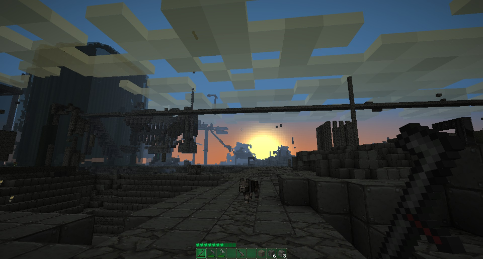 A sunset over a large, abandoned base with a stone floor and walls, featuring a large stone structure in the background.