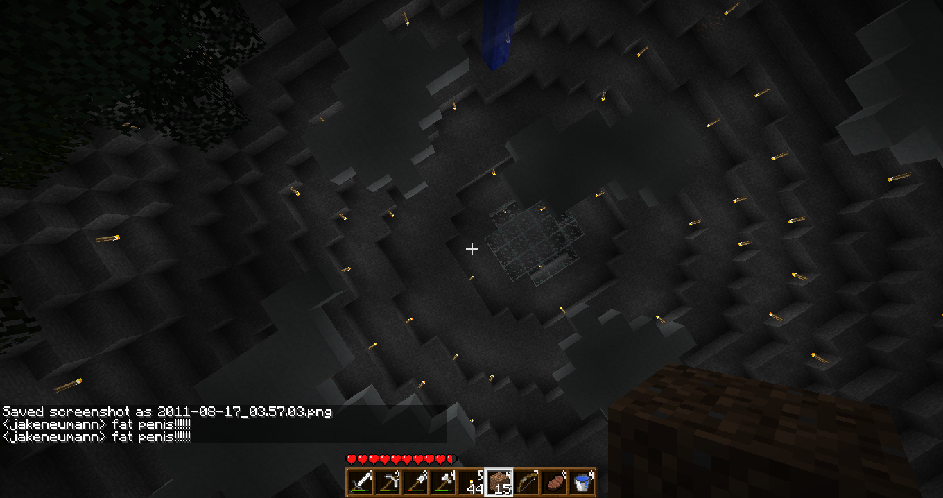 A dark and mysterious cave with a large, circular structure in the center.