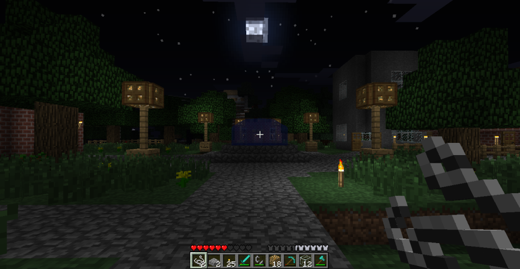 A nighttime scene of a Minecraft base, with a pathway leading to a building and trees surrounding it.