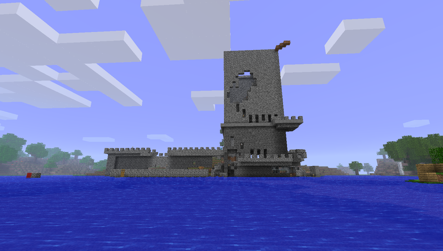 A large castle-like structure in the middle of a body of water, with trees visible on the horizon.