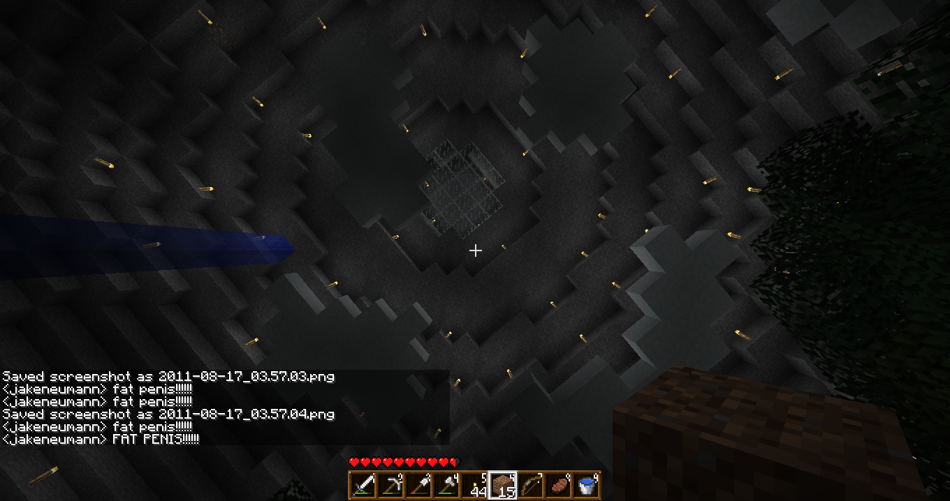A dark and mysterious scene with a large, glowing portal in the center. The portal is surrounded by a halo of light, and there are several blocks of obsidian scattered around it.