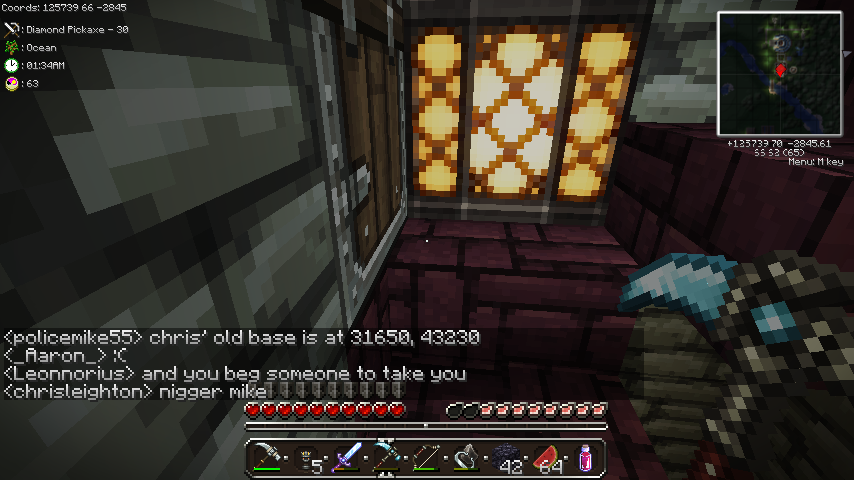 A player is standing in a room with a large window, and there is chat text on the screen.