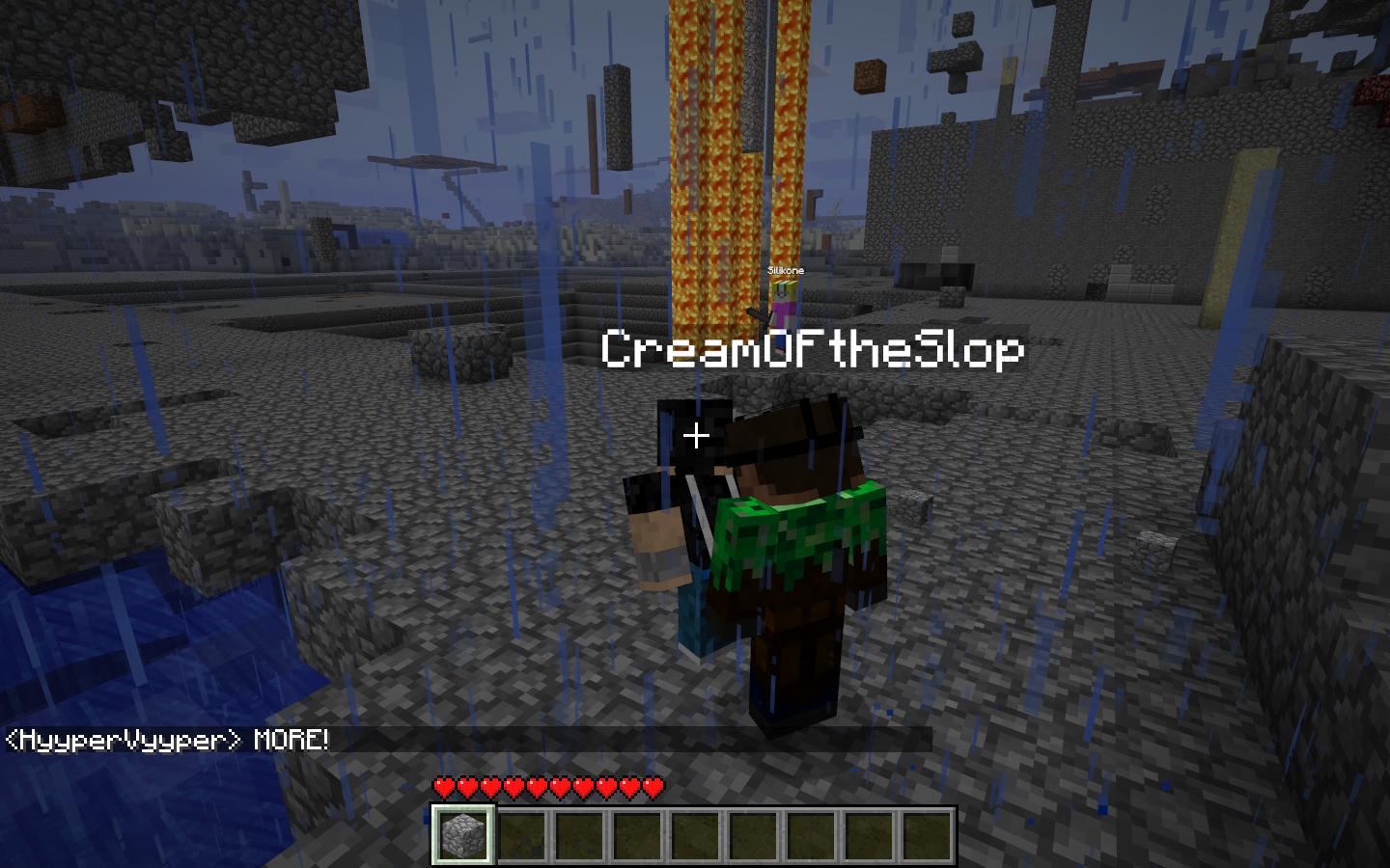 A player standing in a desert biome with a green and black outfit, surrounded by blue pillars and a blue sky.