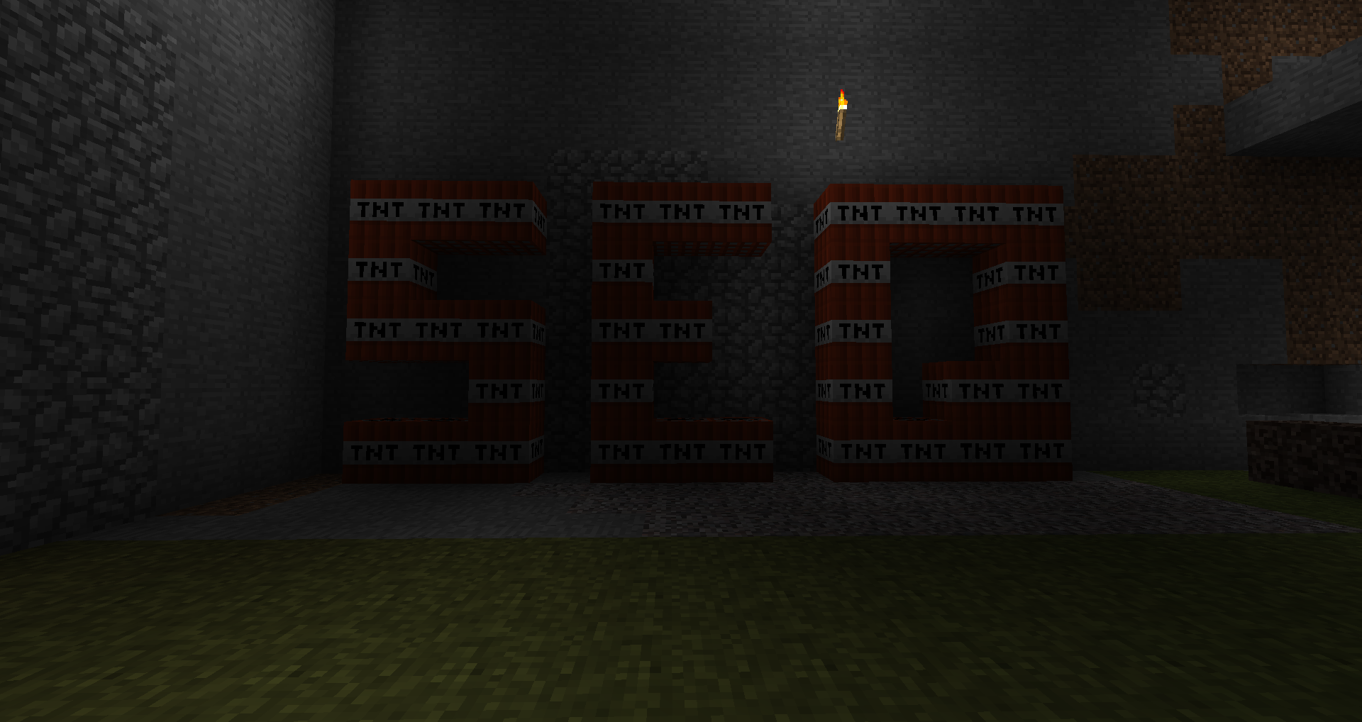 A large room filled with TNT, with a staircase leading up to the right.