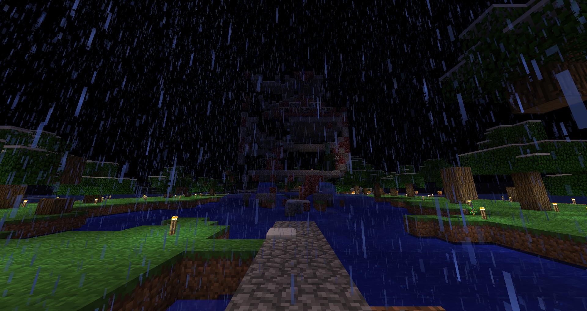 A rainy night scene with a stone path leading to a body of water, surrounded by grassy areas and trees.