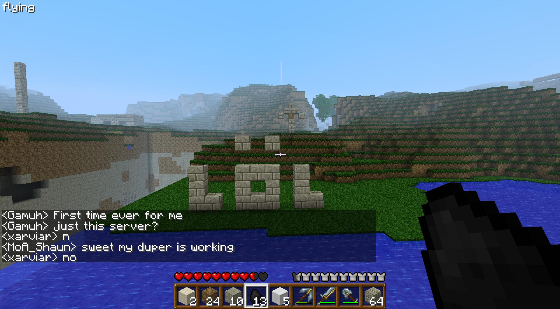 A player is standing in front of a large 'LOL' sign, with a body of water nearby and a chat conversation visible.