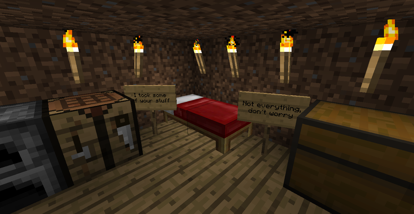A room with a bed, chest, and signs on the walls.