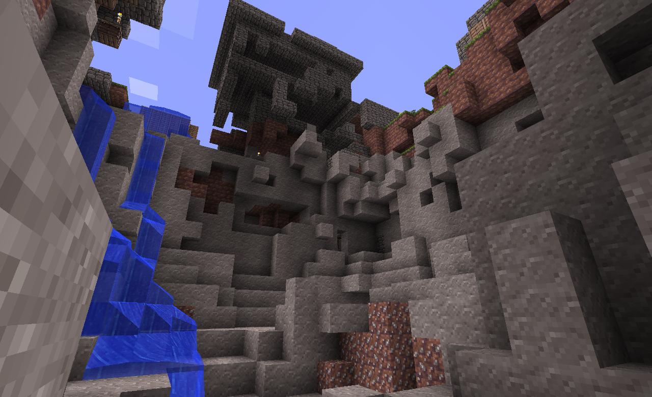 A large, intricate build with a waterfall and a staircase, featuring a mix of stone, brick, and dirt blocks.