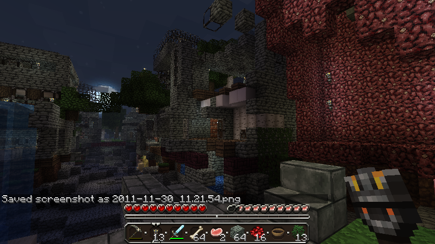 A screenshot of a player's inventory and health in a dark, blocky environment with red and gray blocks.