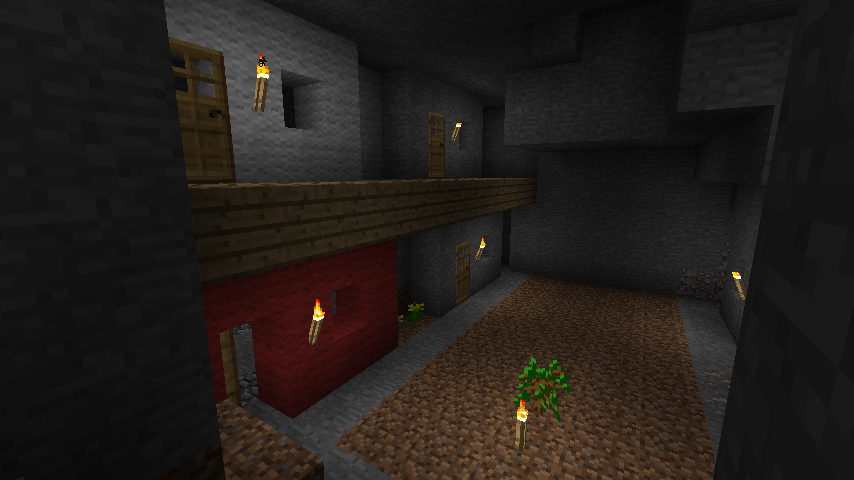 A dimly lit room with a red door and a small tree in the center.