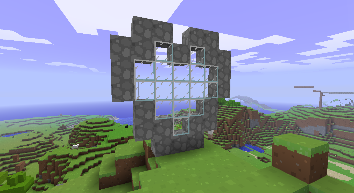 A large, unfinished build in the middle of a grassy plain.
