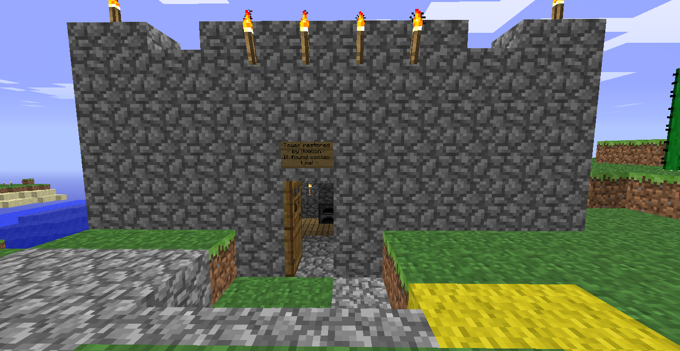 A large stone castle with a yellow path leading to the entrance.