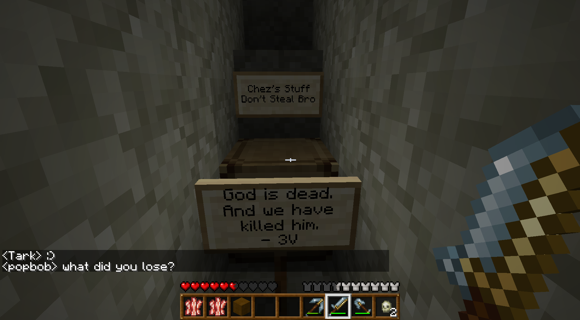 A staircase with signs on each step, and a player's inventory at the bottom.