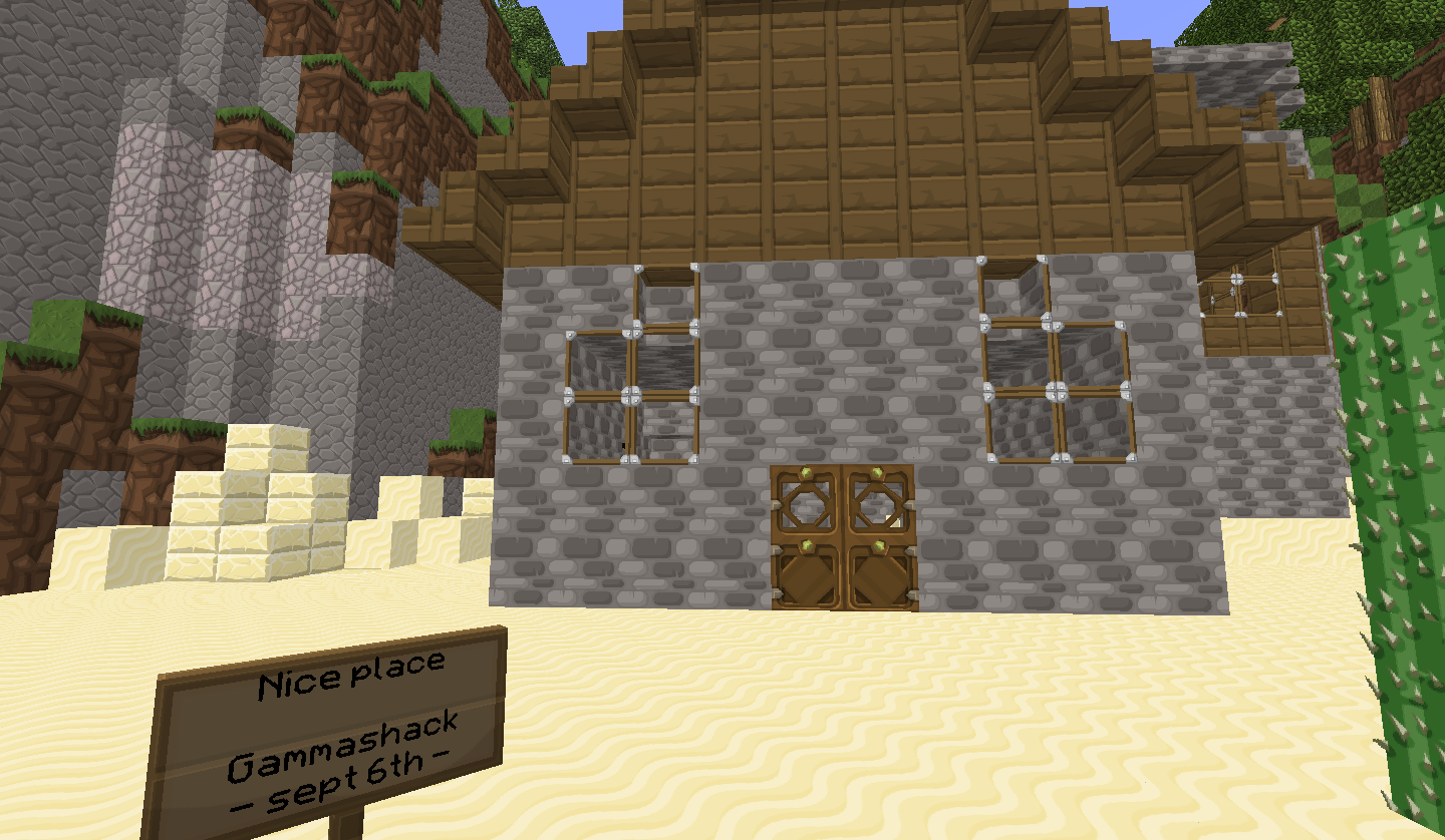 A desert base with a sign that says 'Nice place Gamnashack - sept 6th'.