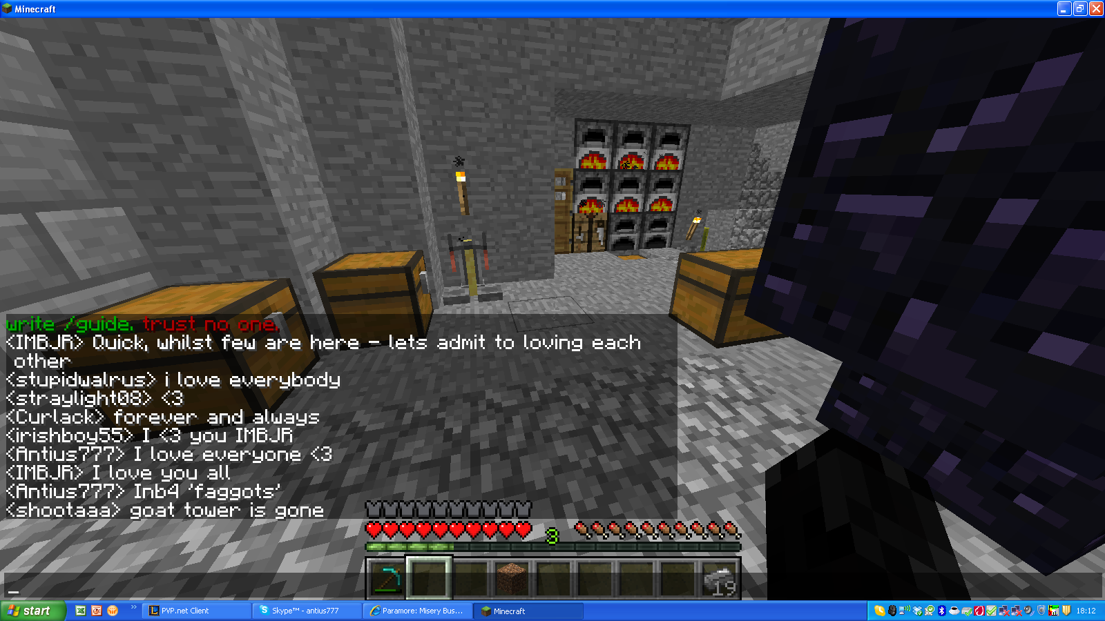 A player is in a room with several chests and a furnace, with chat messages visible.