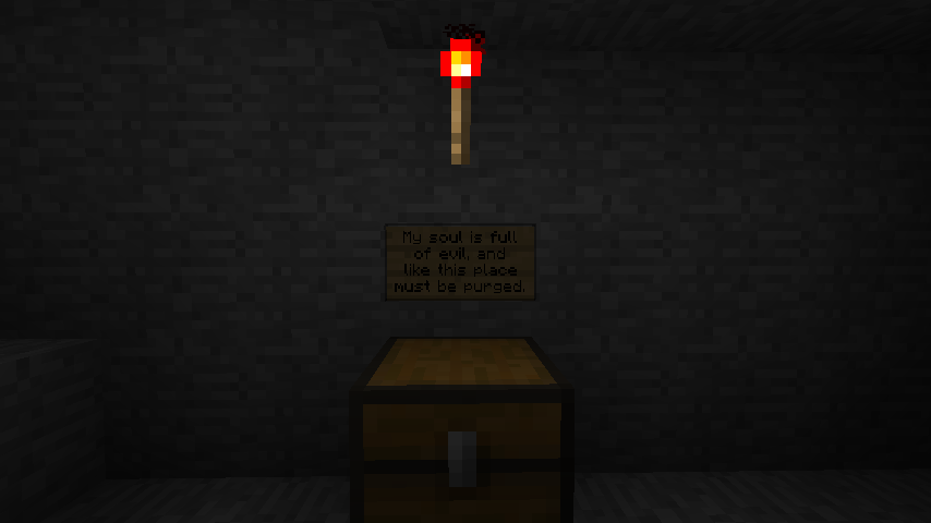 A dark room with a chest and two signs on the wall, one of which is illegible.