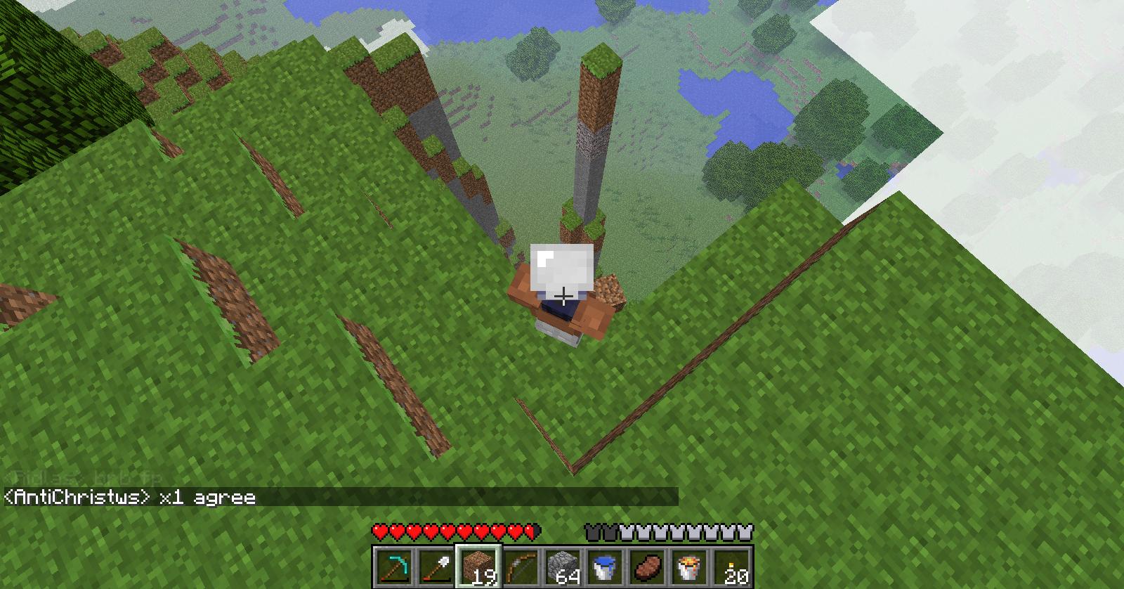 A player is standing in a grassy area with a small structure, possibly a base or a build, and there are chat messages visible at the bottom of the screen.
