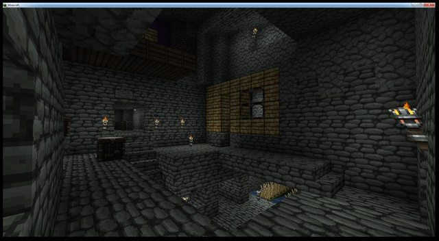 A dark room with a stone floor and walls, featuring a large window on the back wall and a small table in the corner.