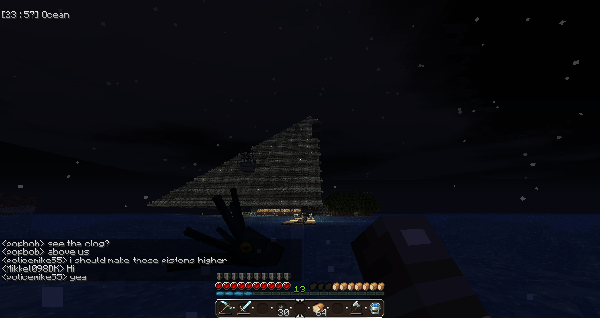 A player is sailing a boat at night, with a pyramid in the background.
