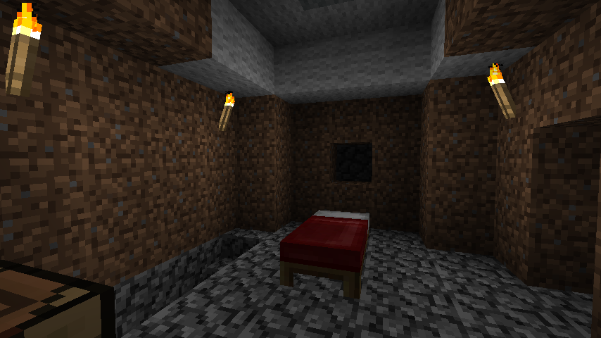 A small room with a red bed and a few lights on the walls.