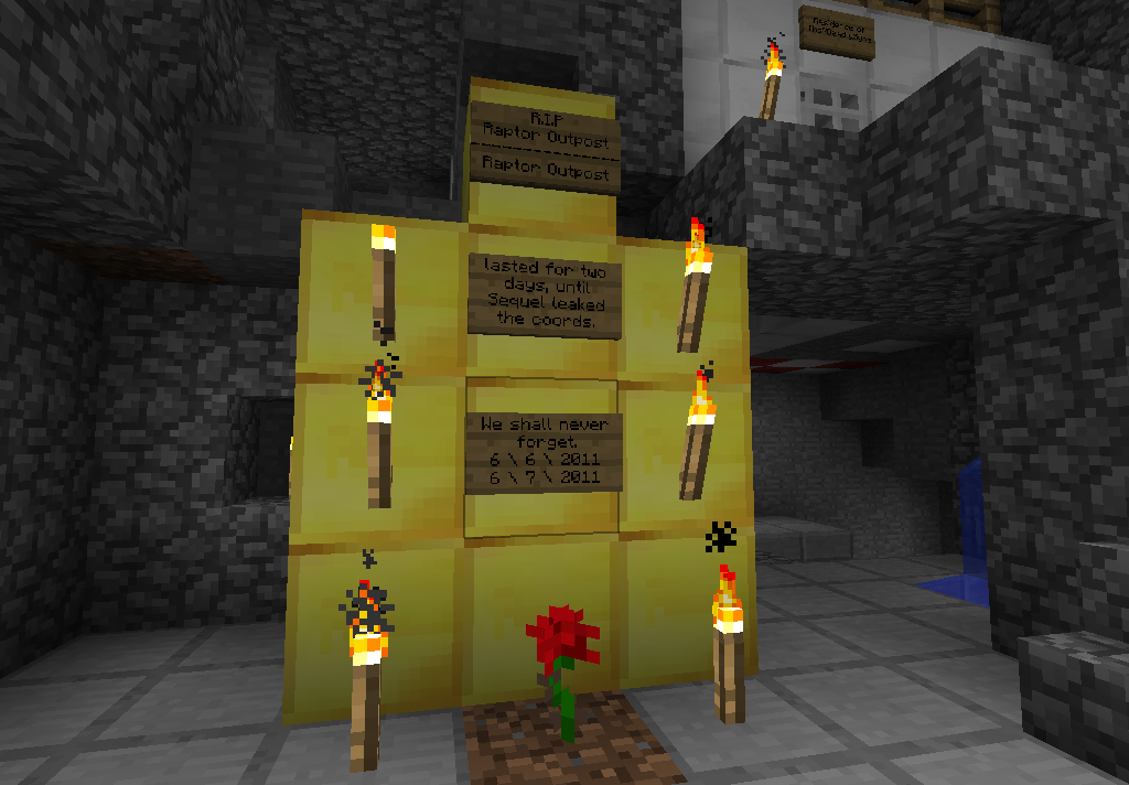 A memorial with signs and flowers in a cave.