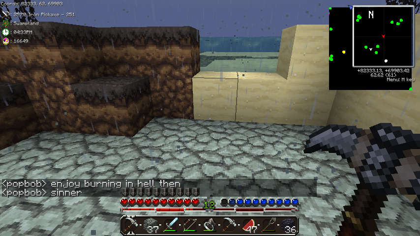 A player is standing in a desert biome, with a large stone structure in the background. The player's inventory is open, showing various items.