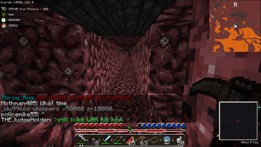 A player is in a cave with a lava pool, surrounded by redstone and obsidian blocks. The player's inventory is visible at the bottom of the screen.