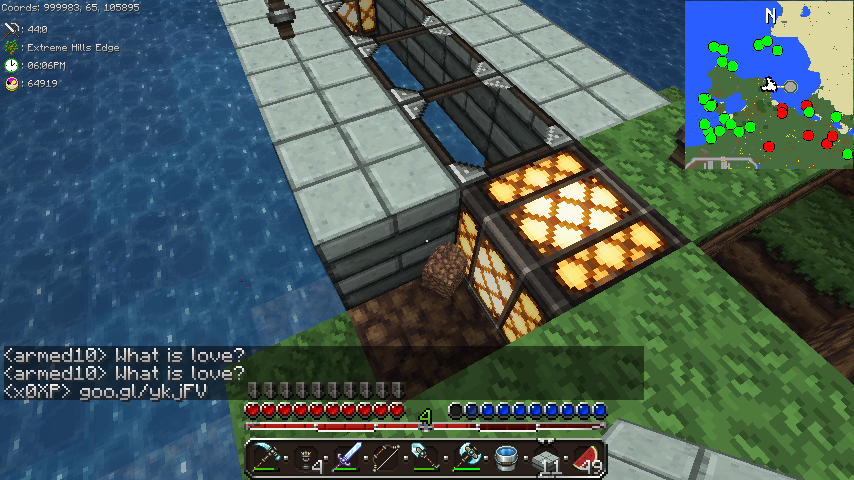 A player is building a base with a large glass window and a tree nearby, with chat messages visible.