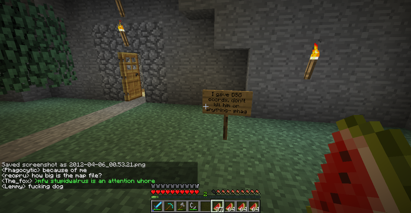 A dimly lit room with a watermelon in the foreground and signs on the wall, with chat messages visible.
