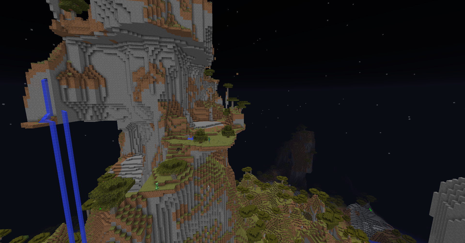 A large, intricately designed castle with a moat and a drawbridge, surrounded by a forest and a mountain range.