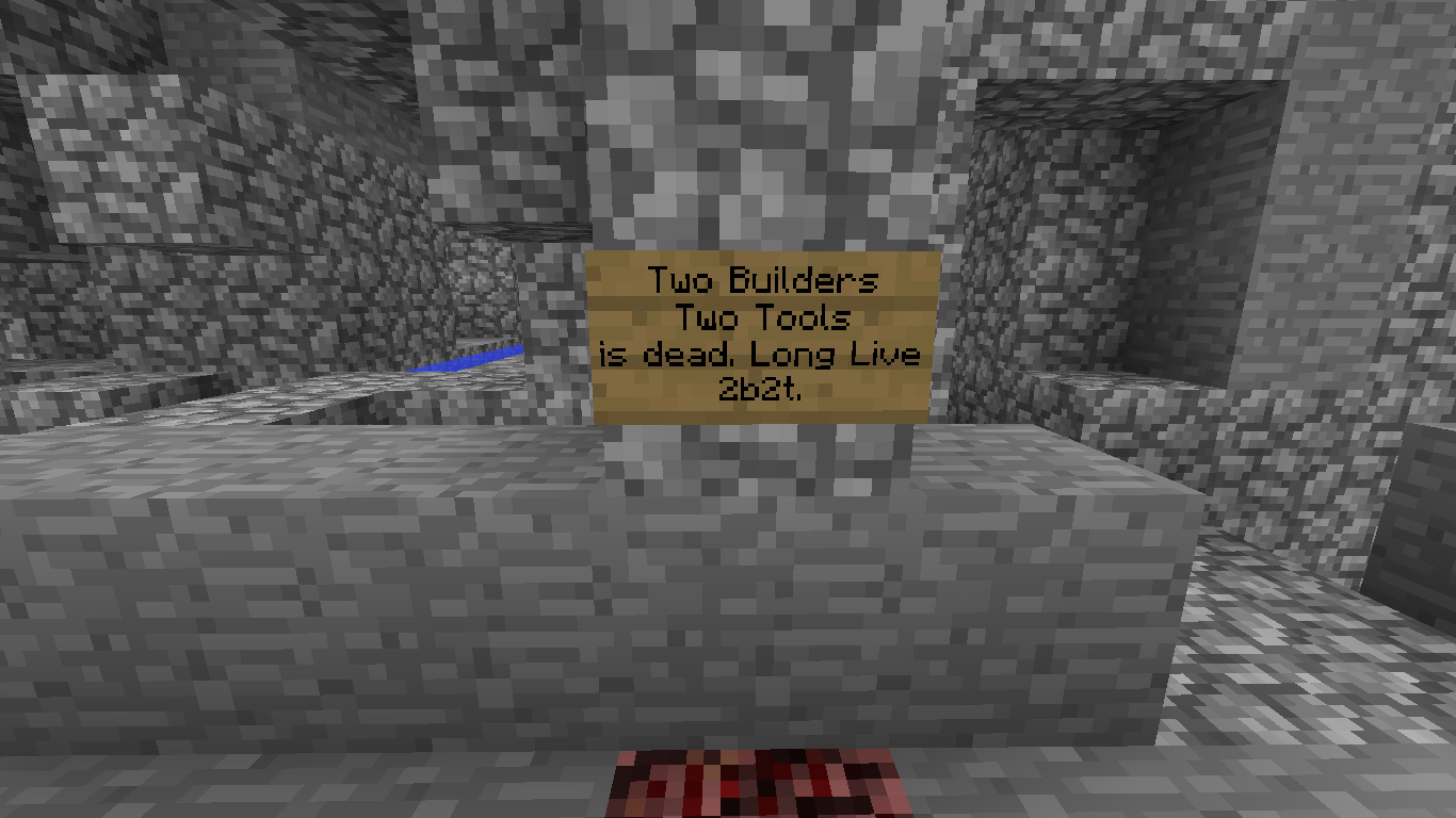 A sign in a cave with a message about two builders and two tools being dead. Long Live 2b2t.