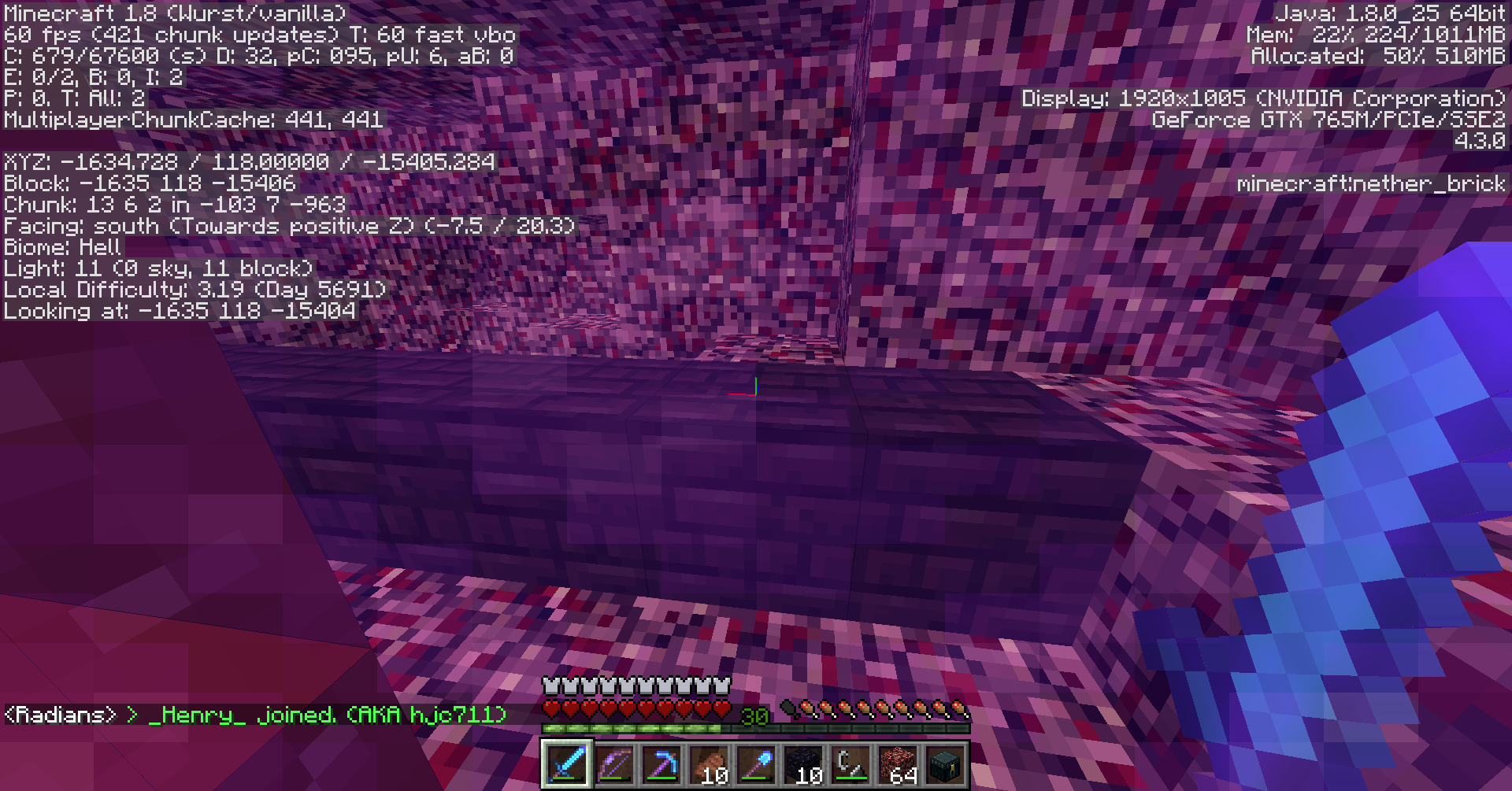 A player is in a cave with a large amount of chat messages.